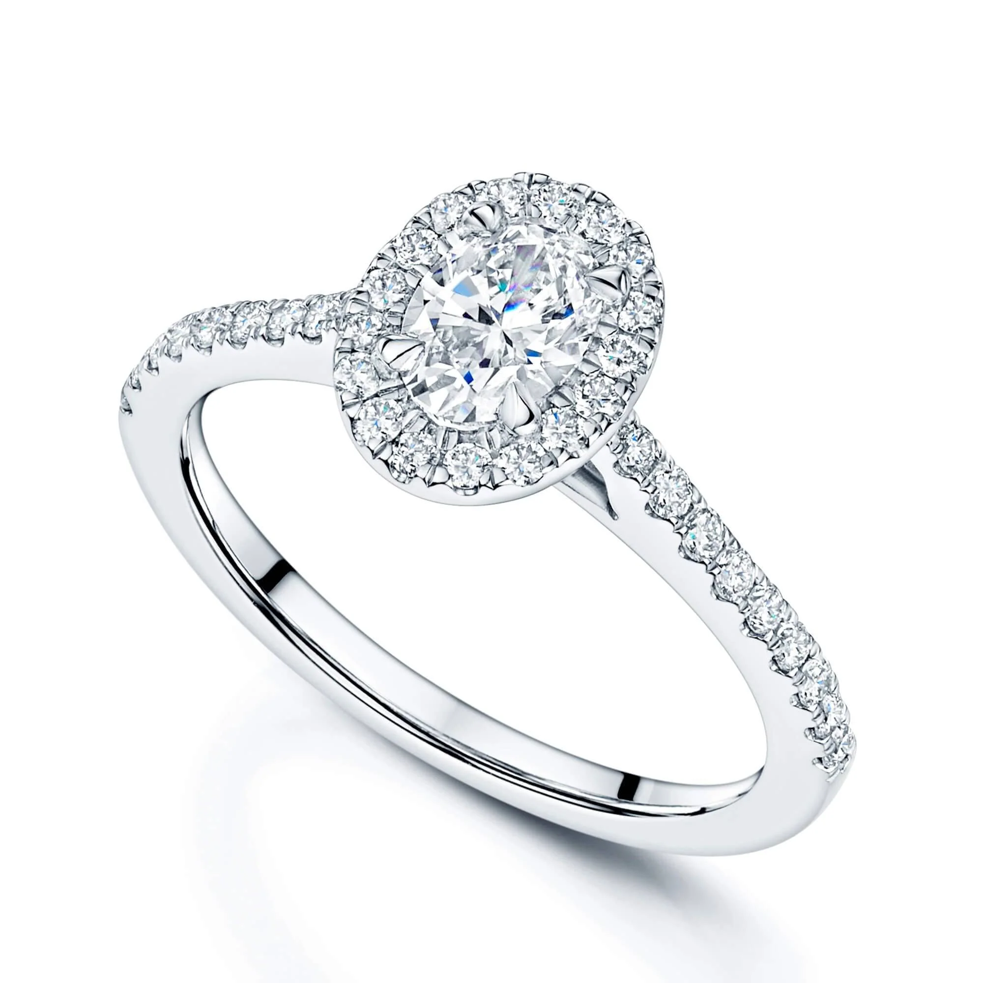 Platinum and Oval Cut Diamond Halo Ring With Round Brilliant Diamond Shoulders