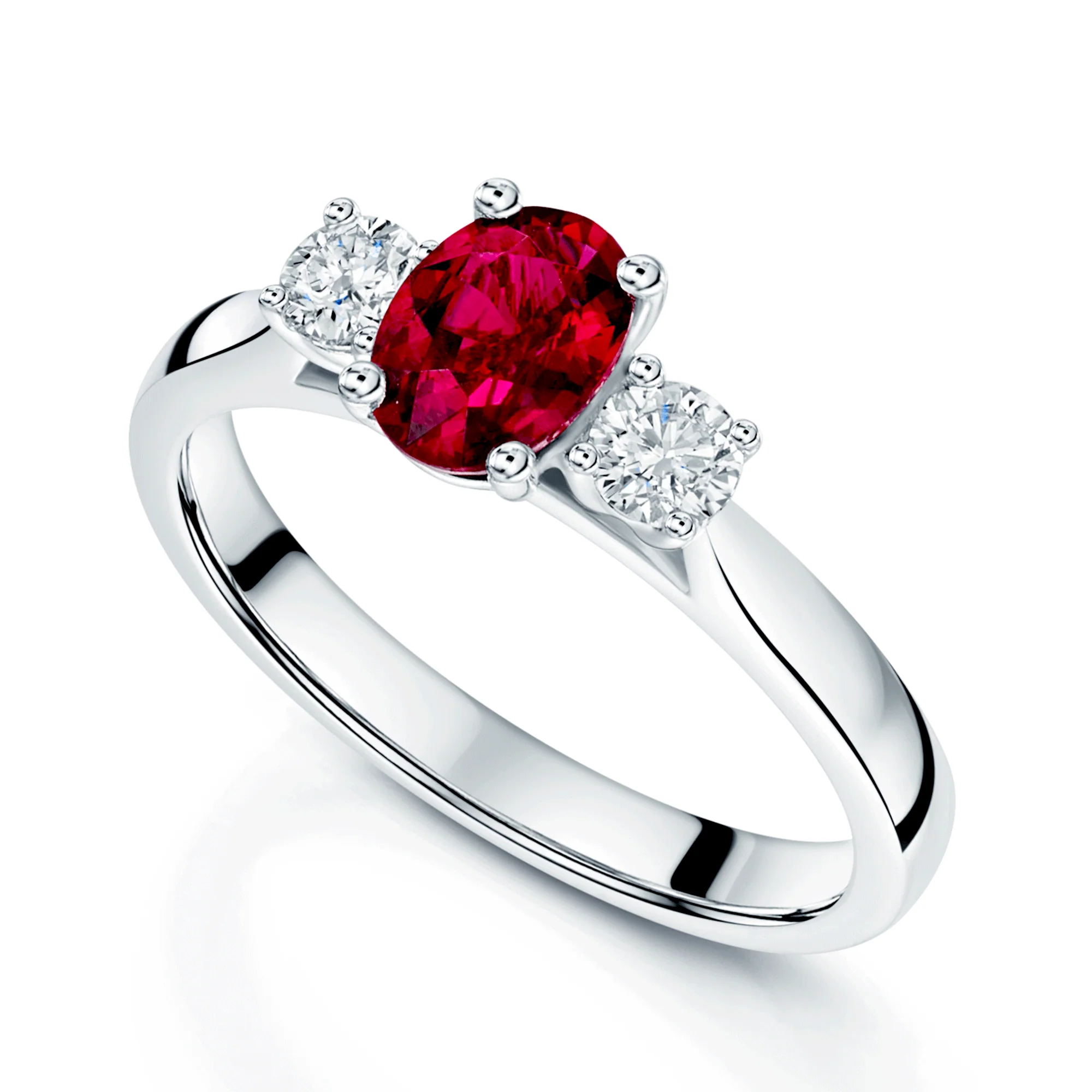 Platinum and Oval Cut Ruby And Diamond Three Stone Ring